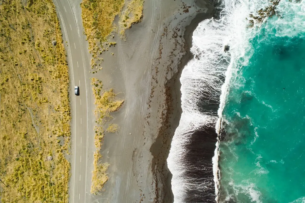 A coastal road north of Auckland seen from above